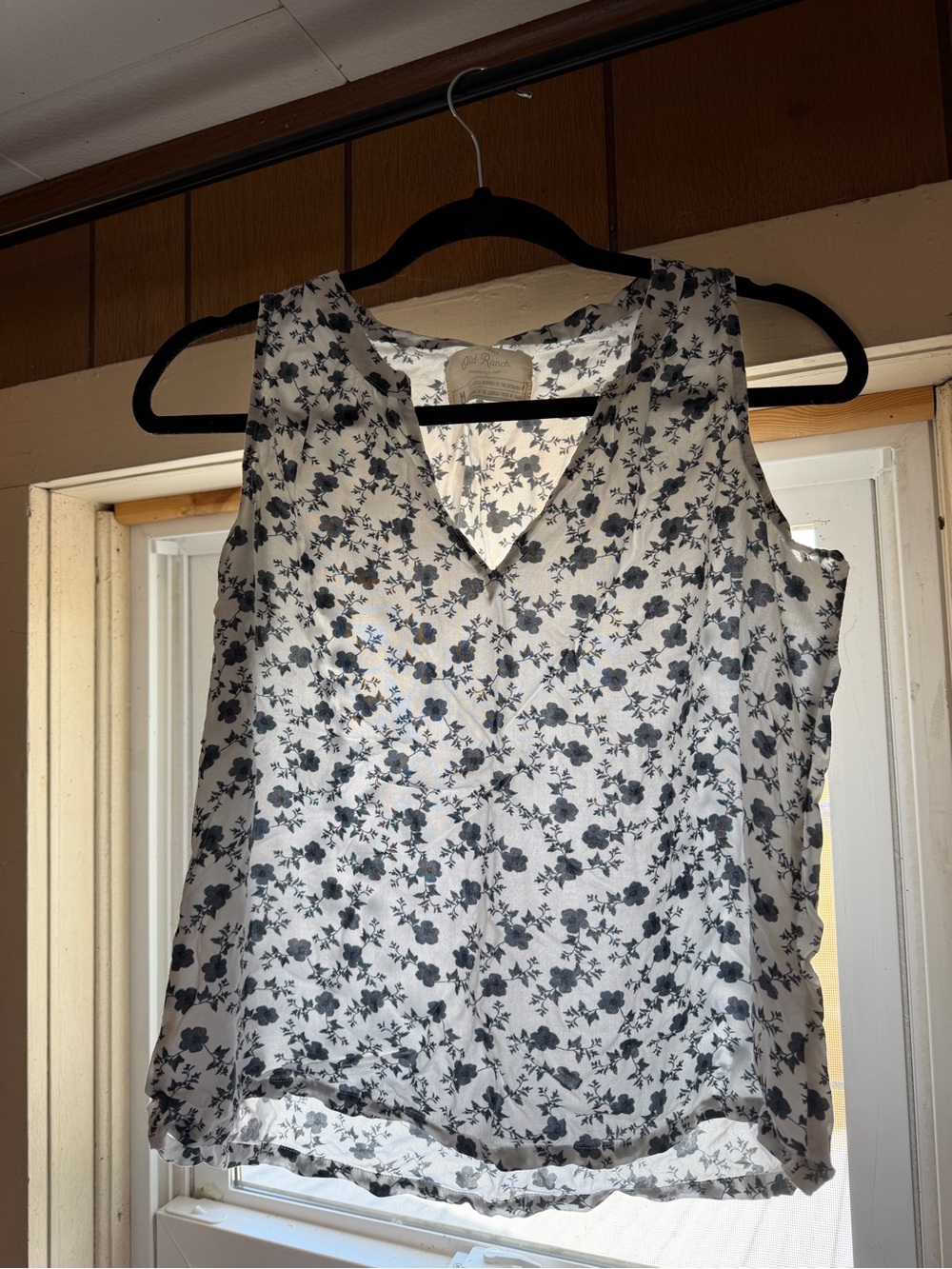 Blue and White Sleeveless Floral V-Neck Blouse